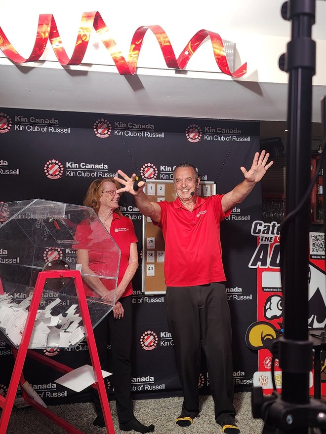 Kin Club of Russell volunteers celebrate at the weekly Catch the Ace draw